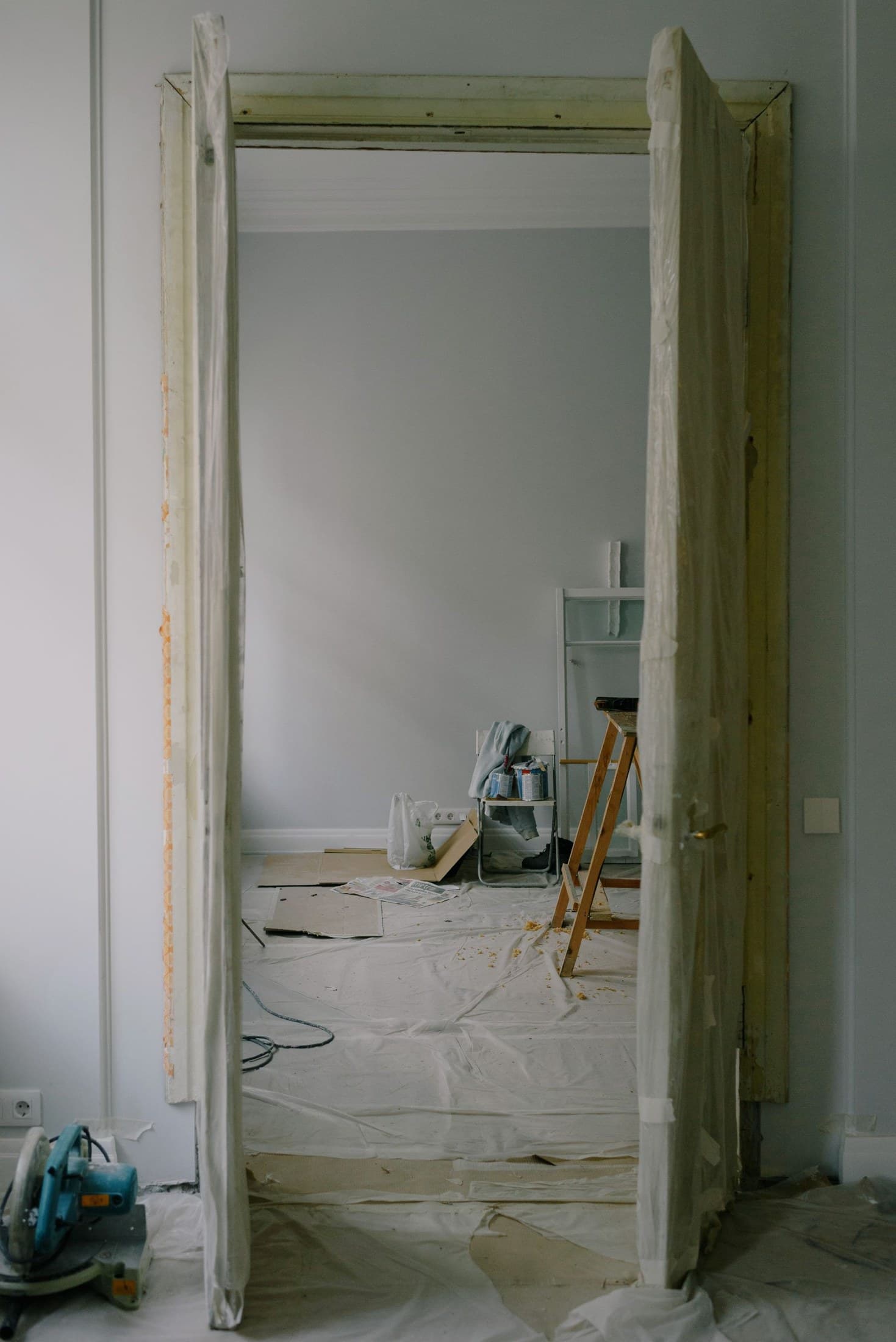 Residential interior undergoing renovation, with unfinished walls and building materials